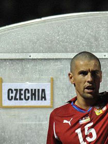From international football match Lithuania vs.Czechia - Milan Baroš greets fans in front of players bench with the designation CZECHIA (qualifying round of Euro 2012; Oct. 2011)